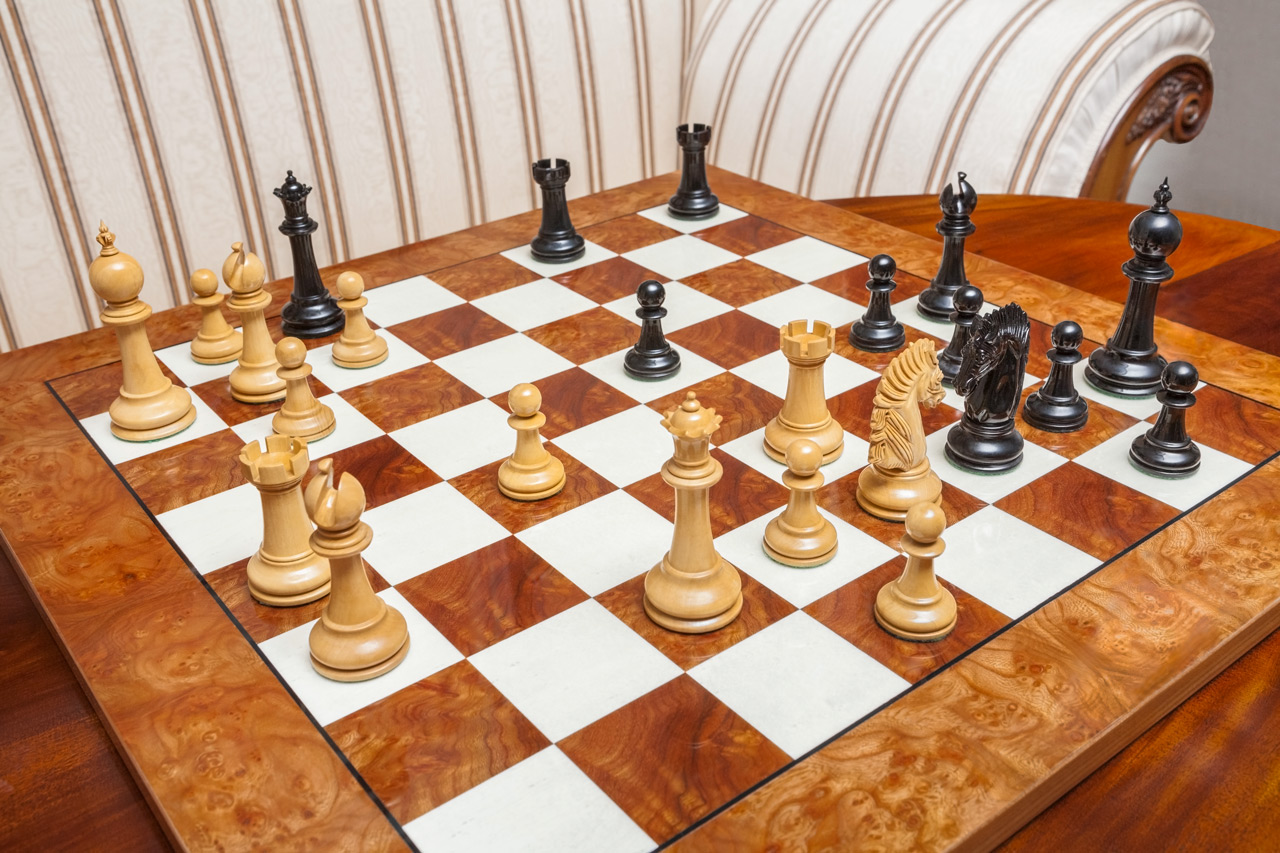 Duke ebony and boxwood pieces in a game position on the Da Vinci board, viewed from above