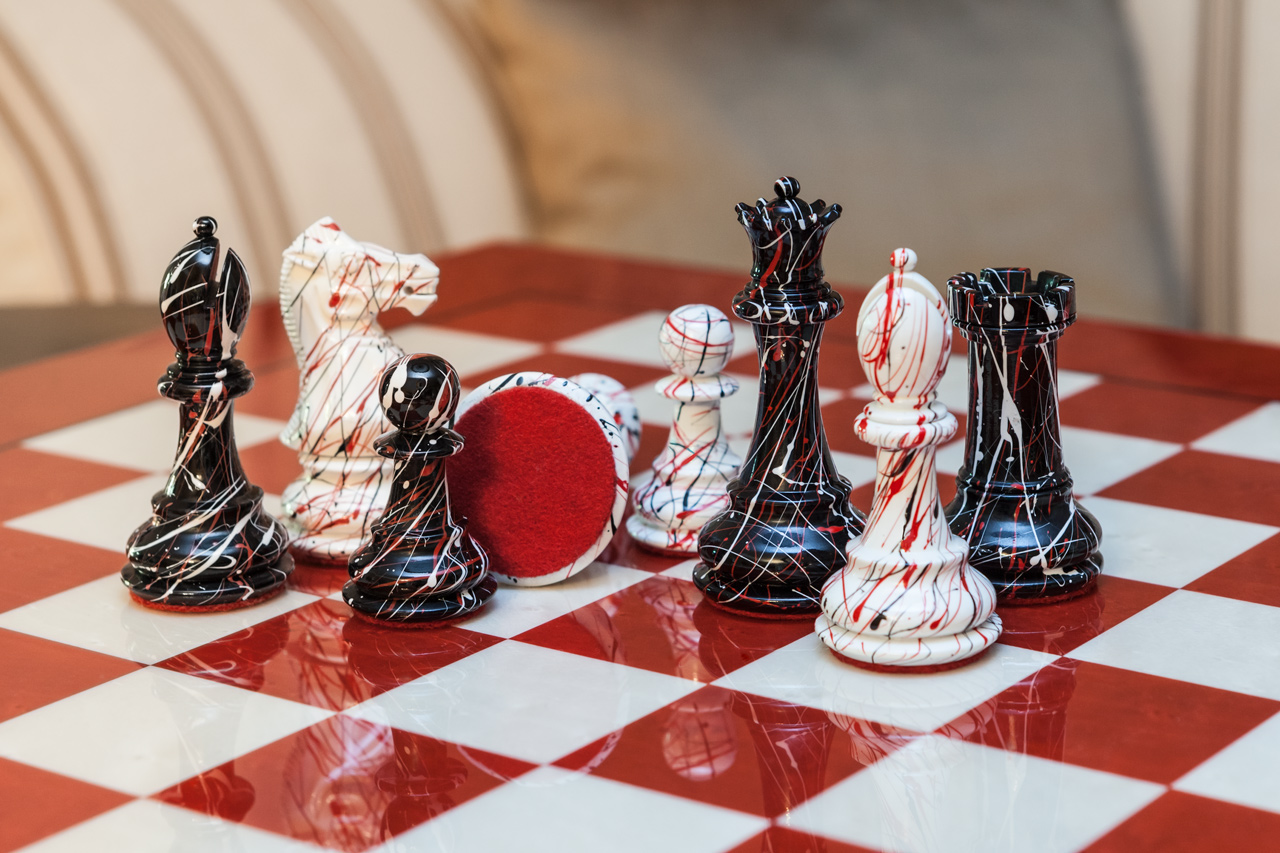 New York black-and-white pieces grouped on the Bologna board, with one red felt base visible