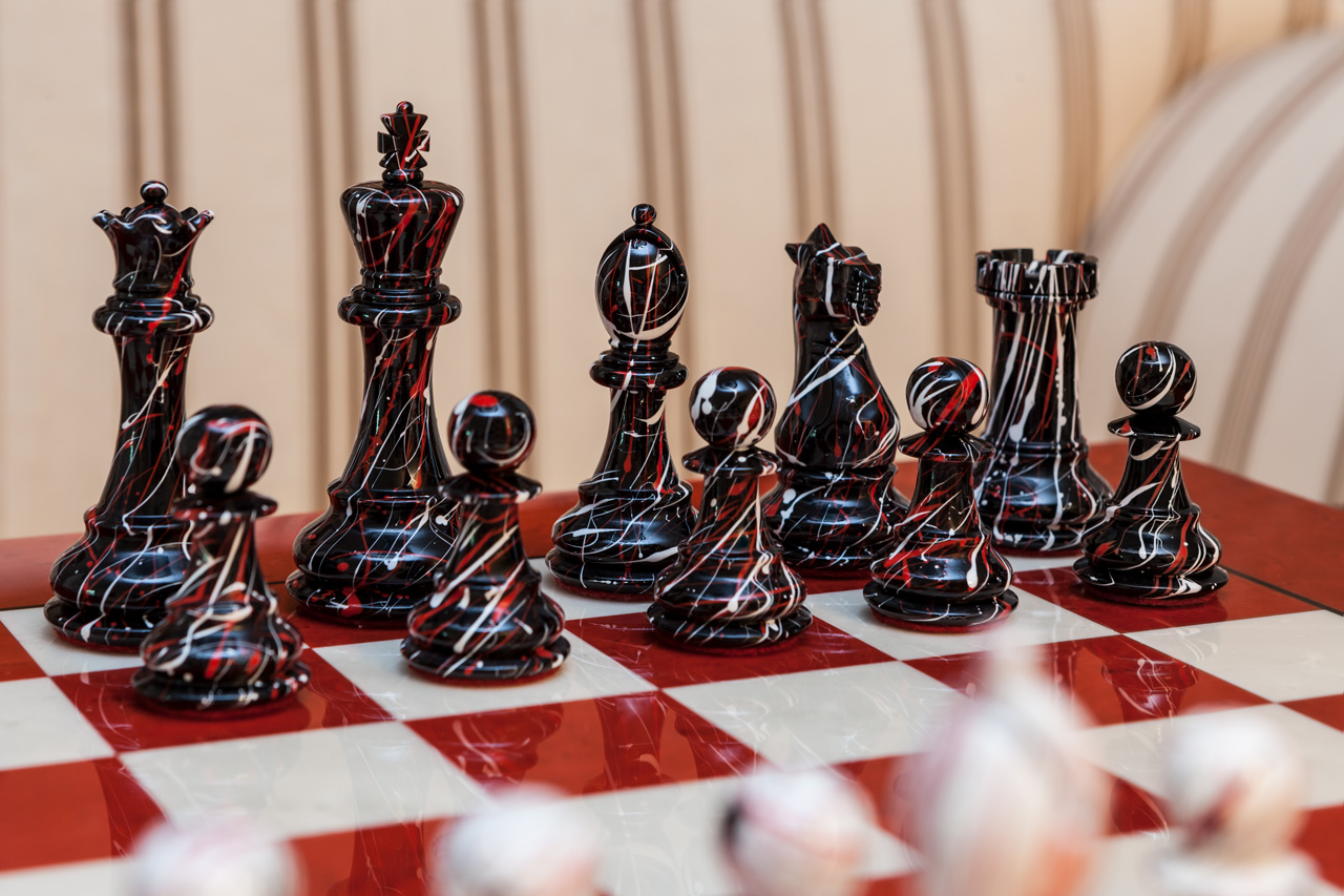 Close-up of the black New York pieces with red veining on the Bologna board