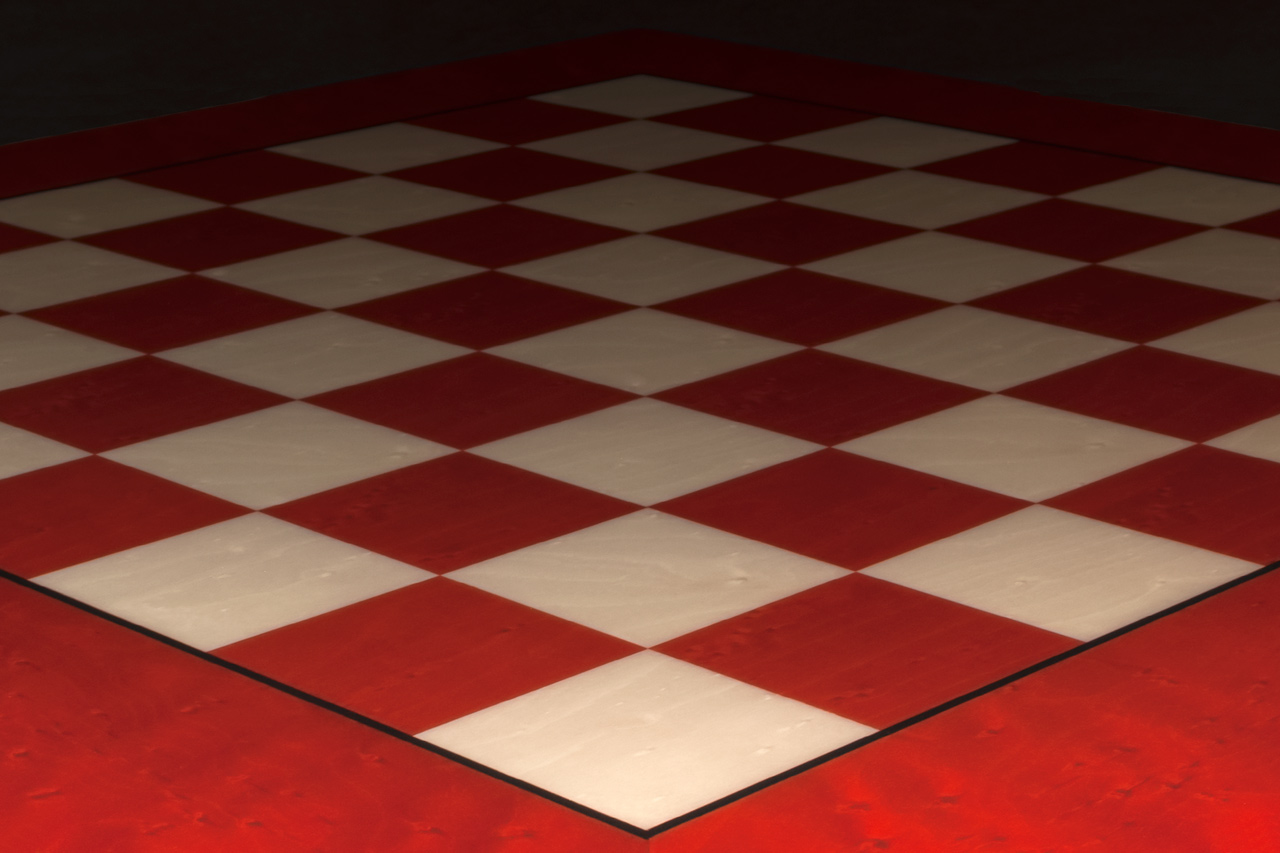 Close-up of the red maple squares and border of the Bologna chess board