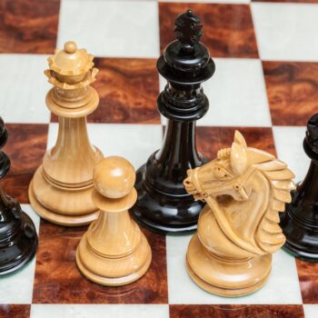 Overhead view of Regal lacquered ebony and boxwood chess pieces on the 60 cm Da Vinci chess board