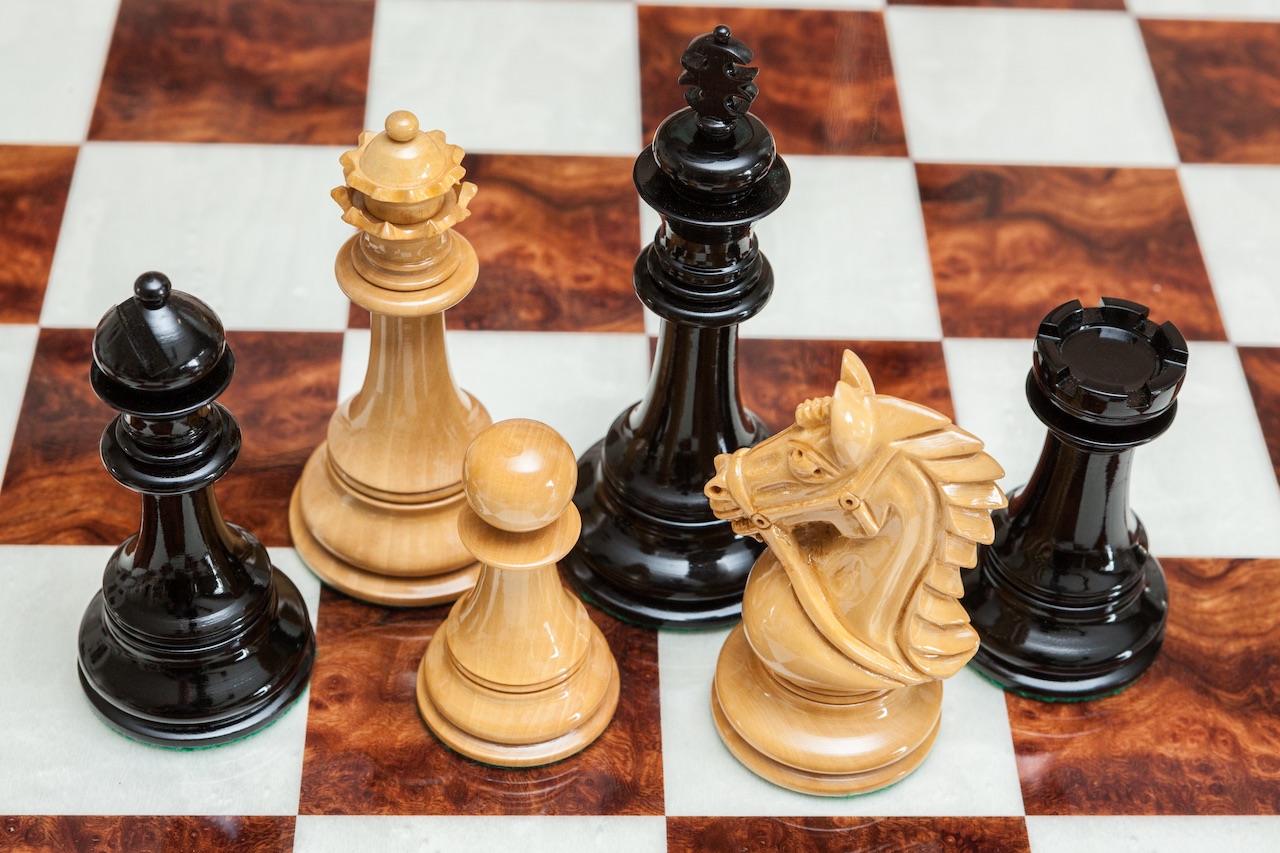 Overhead view of Regal lacquered ebony and boxwood chess pieces on the 60 cm Da Vinci chess board