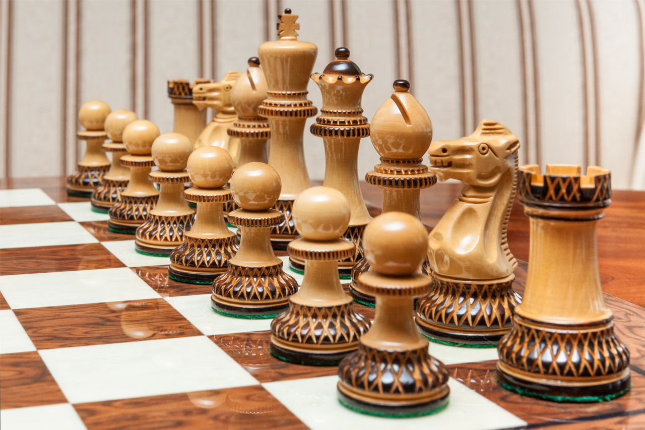 Close-up of the light burnt boxwood Vulcan pieces on the Cordoba board