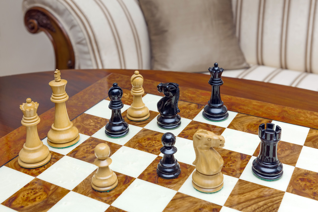 Shown with: 51 cm Venezia chess board High-angle view of Viking lacquered boxwood and ebony chess pieces on the 51 cm Venezia chess board