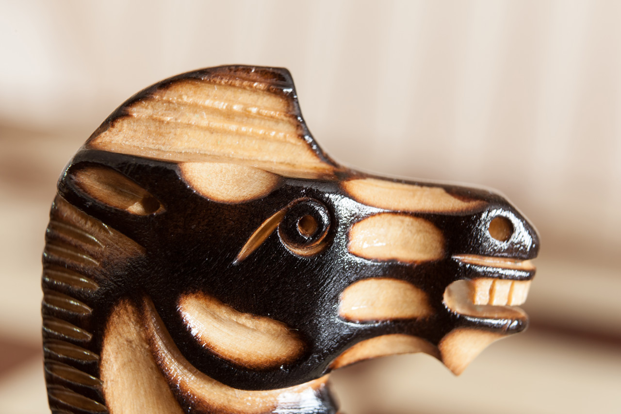 Close-up of a burnt boxwood Vulcan knight from the Vesuvius set